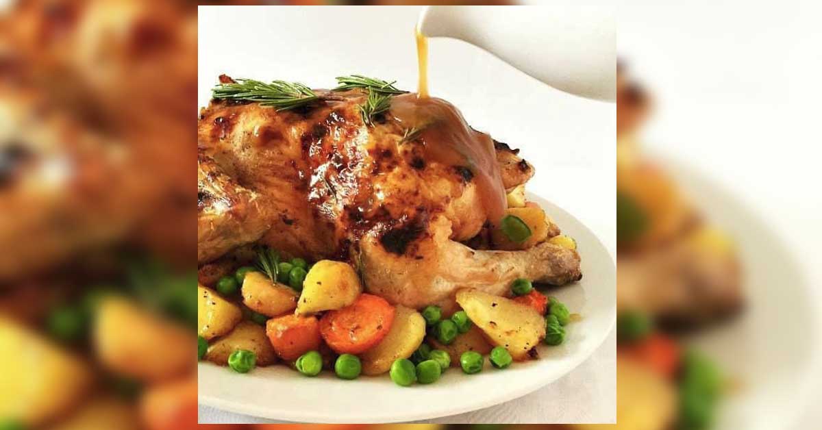 A plate of chicken, potatoes, and vegetables, presented at a restaurant in Haarlem.